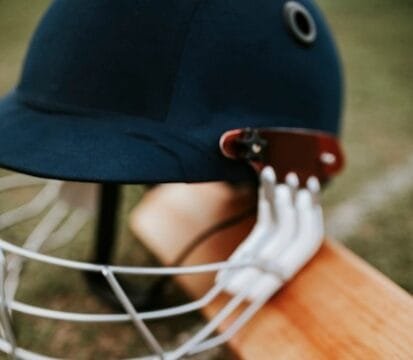 cricket-equipments-green-grass_53876-63200